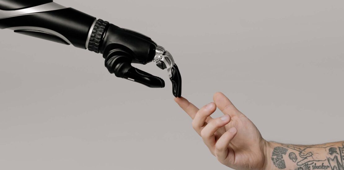 robot and human hands touch
